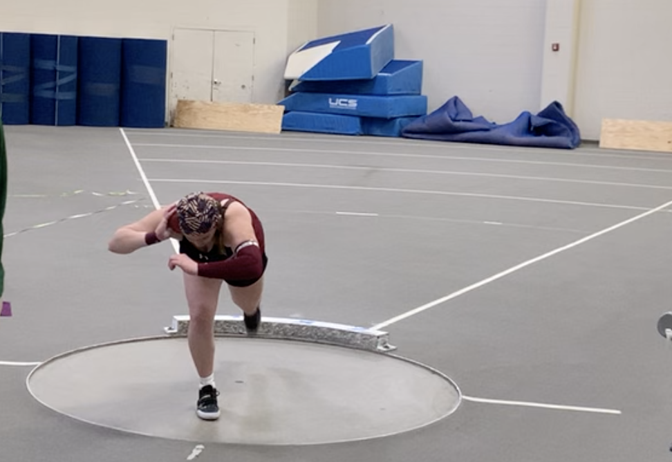 Aleena Brown begins her glide during her flight of the women's shot put competition. 